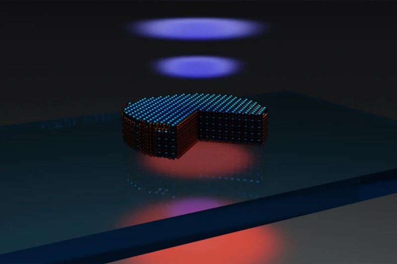 Schematic of the optical experiment: Excitation near-infrared laser (red bottom one) - excites the nanodisk fabricated from the 3R-molybdenum disulfide flake, standing on a glass substrate. The quarter-cut-section of the disk schematically shows that incident laser excites optical resonances, that's why we see red areas which represent higher density of electromagnetic field. This localisation alongside with the crystalline lattice broken inverse symmetry allow for effective conversion of red pump laser into blue light (doubled frequency). Illustration: Prof. Georgii Zograf / Chalmers University of Technology.