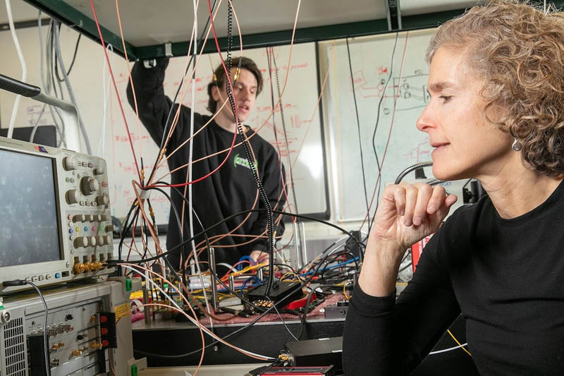 Michael Cullen, graduate student, works with Prof. Keren Bergman in the Lightwave Research Laboratory. Credit: Timothy Lee/Columbia Engineering.