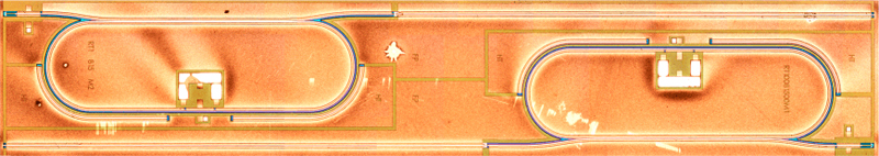 
Optical microscope image of the quantum cascade photonic integrated chip. Shown chip contains two identical devices each comprising four components: a Fabry-Perot drive laser, a waveguide coupler, a resistive heater, and a racetrack resonator. 