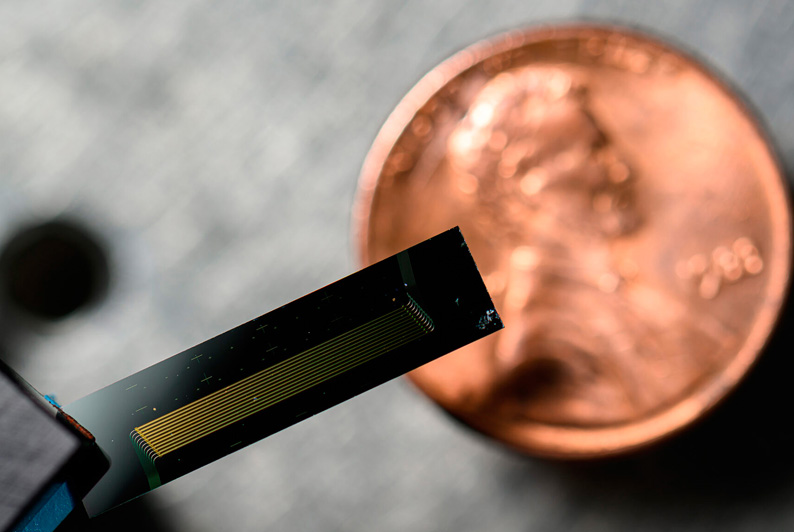 Chip-scale laser developed by researchers in the lab of engineering professor Qiang Lin can conduct extremely fast and accurate measurements by very precisely changing its color across a broad spectrum of light at very fast rates. Photo: J. Adam Fenster, University of Rochester.