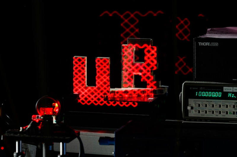 Rochester researchers demonstrate how their laser could be used to drive a lidar system on a spinning disc and identify the letters U and R made out of Lego bricks. Photo: J. Adam Fenster, University of Rochester.