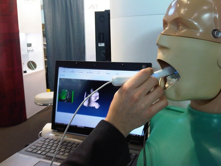 The 3D dental scanner, seen here being used to scan teeth inside the head of a model, was initially developed at the Austrian Institute of Technology (AIT), an institute that is half-owned by the Austrian state. A network of industrial companies owns the other half.