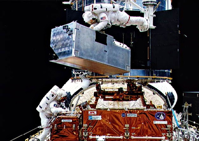 The Corrective Optics Space Telescope Axial Replacement (COSTAR) mission in 1993 to fix the Hubble Space Telescope's problems with spherical aberration was delivered by Ball Aerospace using optics made by the former ASML Optics division in Richmond, California. That division is now part of Zygo and is performing strongly. Meanwhile, the COSTAR optics were removed from Hubble in 2009 and are now on view at the Smithsonian's National Air and Space Museum in Washington DC. Credit: NASA/ESA.