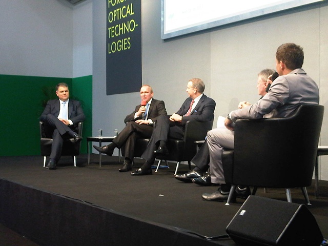 Four of the most powerful men in photonics. From left: John Ambroseo, the CEO of Coherent; Ulrich Simon of Carl Zeiss Microimaging; CVI Melles Griot's Stuart Schoenmann; and David Marks from Qioptiq. Main image: Messe M&uuml;nchen 2011.