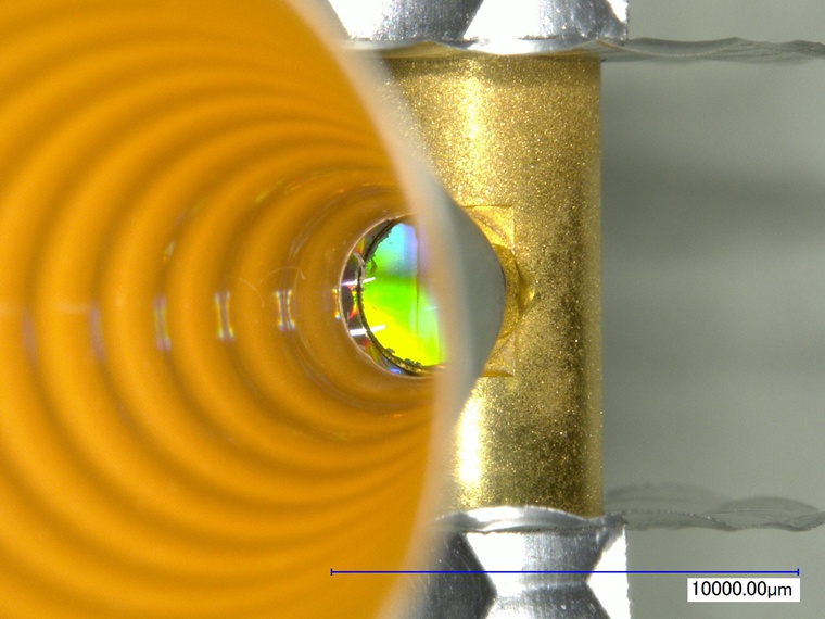 A diamond target sits at the end of a diagnostic cone attached to the gold hohlraum, or target. Credit: LLNL/NIF.