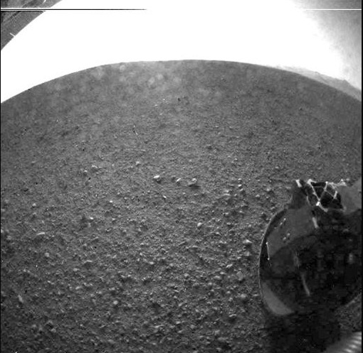 One of the first images taken by NASA's Curiosity rover, which landed on Mars on the morning of August 6, 2012. This image was taken through a fisheye wide-angle lens on the left 