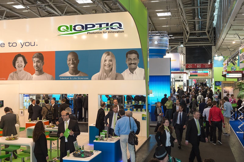 Qioptiq's booth at Laser 2013 trade show held in Munich last May. The company's bright green and white kites are a familiar sight at photonics events. Credit: Messe M&uuml;nchen.