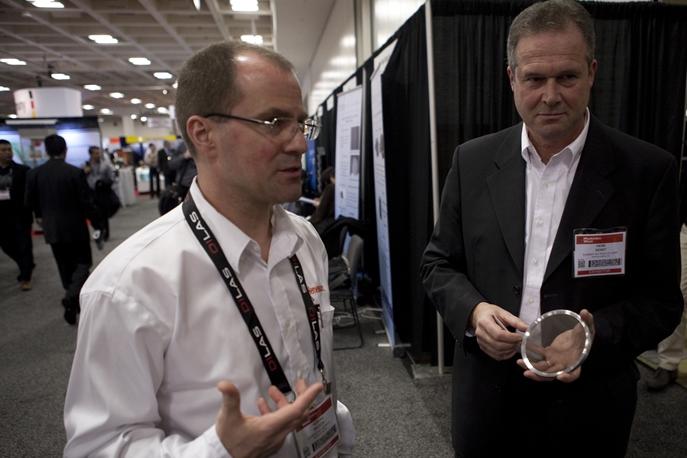 Element Six representatives at Photonics West: head of technologies Adrian Wilson, left, and (holding what is claimed to be the world's largest diamond window) business manager for optical applications, Henk de Wit. Credit: Joey Cobbs/SPIE.
