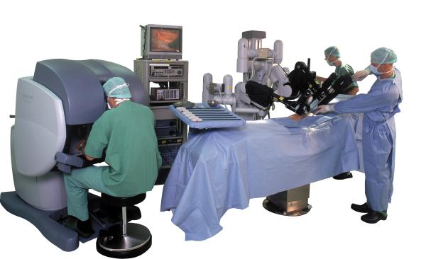 The complete da Vinci surgical system includes a console where the surgeon sits while operating, a patient-side cart where the patient lays during surgery, four interactive robotic arms, and a high-definition 3D vision system. Credit: Intuitive Surgical.