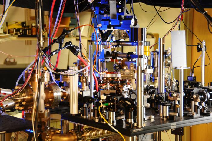 Ytterbium atoms are manipulated and probed by laser light carried in five fibers, including the yellow fiber in the lower center of the photo. Credit: Burrus/NIST