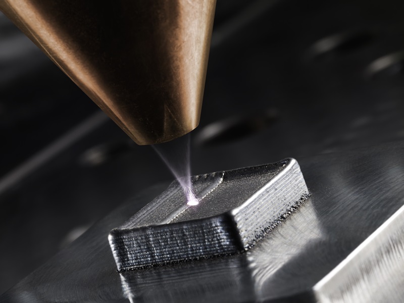 Laser deposition welding on a workpiece, a technique closely related to laser additive manufacturing of metal components. Credit: Trumpf Group.