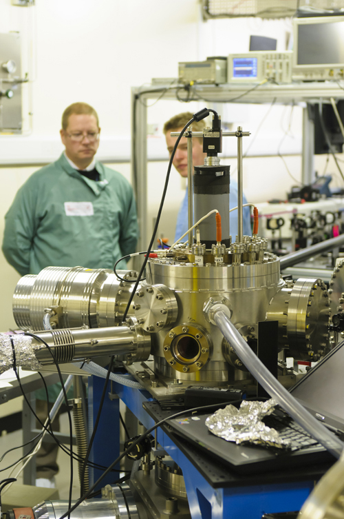Experiments were performed under high vacuum conditions. This picture shows the vacuum apparatus where rotations of complexes were excited and measured. Prof. Andrew Ellis (on the left) and Gediminas Galinis discuss the the experiment. Photo: Dr Mark Watkins.