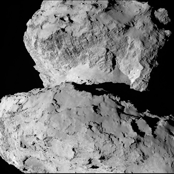 Comet 67P/Churyumov-Gerasimenko, as imaged by Rosetta's OSIRIS narrow-angle camera on 7 August from a distance of 104 km. The comet's head (in the top half of the image) is covered with parallel linear features, while the neck (at the center of the image) shows scattered boulders on a smooth underground. In comparison, the comet's body (lower half of the image) has a much more jagged appearance. Credit: ESA/Rosetta/MPS for OSIRIS Team.