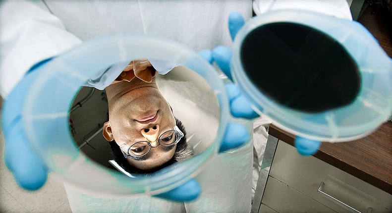 Natcore's black silicon technology is licensed to the US National Renewable Energy Laboratory (NREL). Here, NREL research scientist Hao-Chih Yuan's face is reflected by the silicon wafer before it is washed with a mix of acids to etch millions of holes in its surface to create anti-reflective 