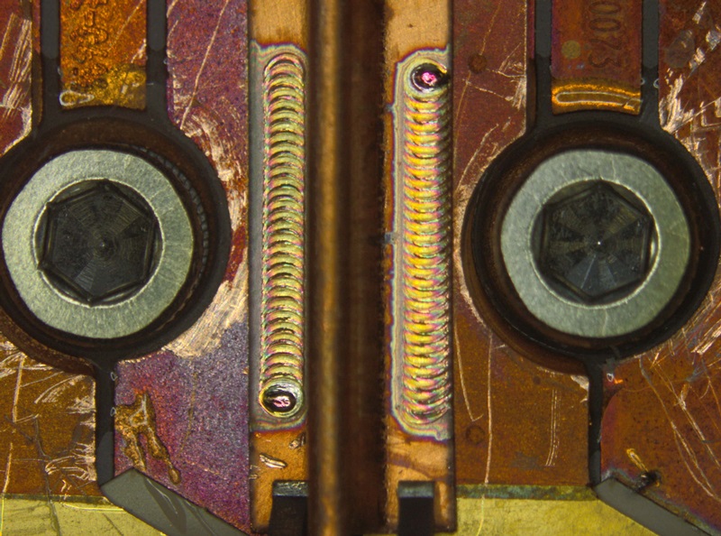 Welding copper works much better with a green laser than with an infrared source, and Trumpf's new TruDisk 421 source delivers an average 400W. This image shows good  uniformity of the welding depth, making it possible to weld thin materials on a tricky substrate like ceramic. Shown in the photo are two copper layers of differing thicknesses (0.2 and 0.3 mm) welded with no apparent damage to the ceramic material lying below. Photo: Trumpf.