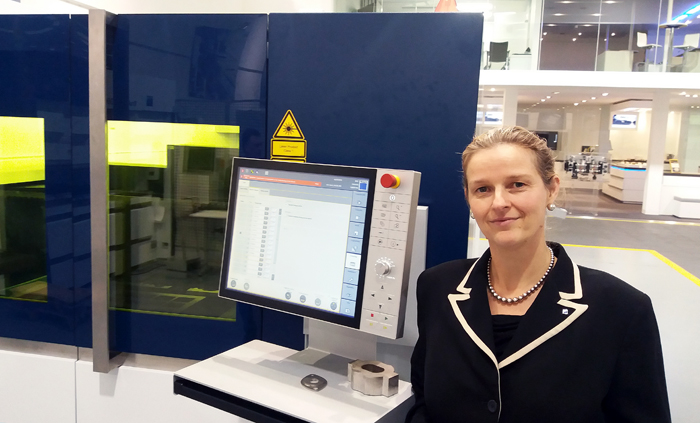 Annette Doyle, Trumpf UK's managing director, with (left) sample of laser-cut 50mm stainless steel. Photo: Matthew Peach. 