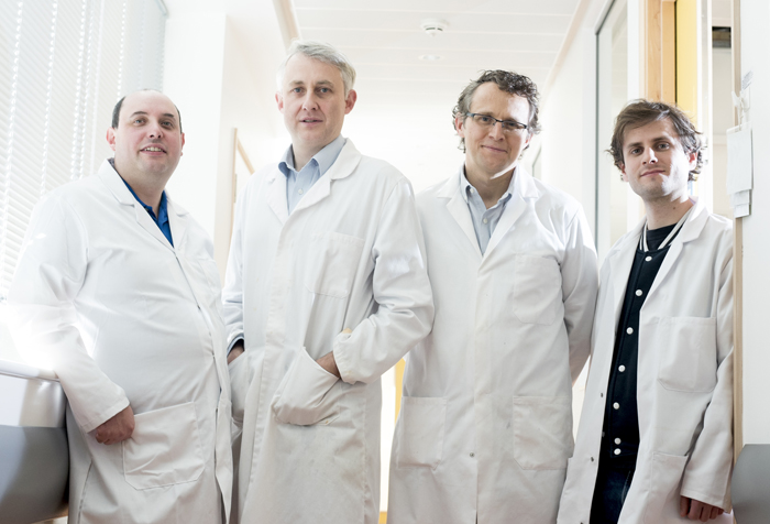 Tin men: Dr Marc Walker in the Department of Physics, with Prof Richard Walton, Dr Ross Hatton and PhD student Kenny Marshall in the Department of Chemistry. Photo: University of Warwick. 