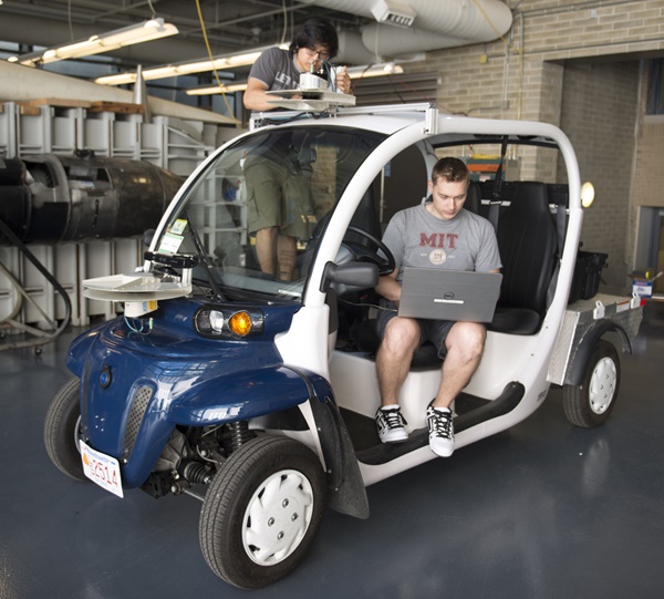 MIT students installing lidar and camera sensors on a campus shuttle. Ford is working with researchers at the Aerospace Controls Lab to advance autonomous vehicle technology. Photo: FOrd Motor Company.