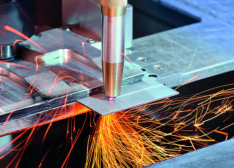 This laser cutting head with diamond optics has built-in water cooling and shield gas supply. Diamond lenses reduce its weight by 90%. &copy; Photo Fraunhofer ILT.
