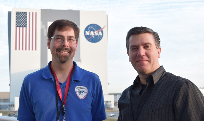 Scott Budzien (left) and Andrew Stephan, lead investigators of GROUP-C and LITES, pose outside of the Kennedy Space Center for the scheduled launch of their experiments. (Photo Credit : Capt. Mark Bruington, Commanding Officer of U.S. Naval Research Laboratory)