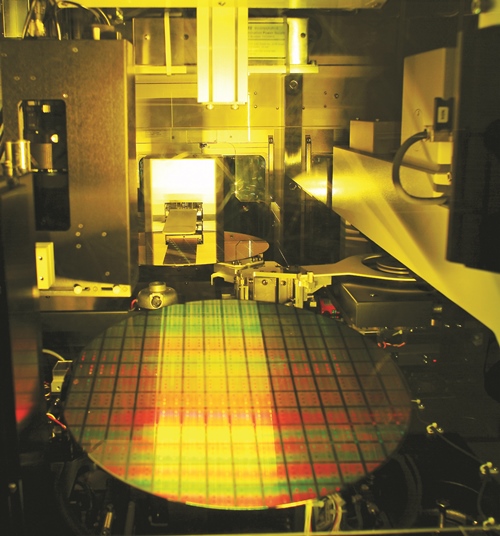 A 12-inch diameter semiconductor wafer in production at the giant Taiwan foundry company TSMC. Ultratech has just reported a slew of new orders for its laser-based equipment to be used in cutting-edge semiconductor production. Photo: Taiwan Semiconductor Manufacturing Company.