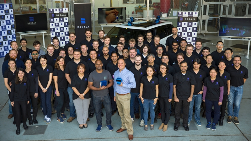 Co-founders Cibby Pulikkaseril and Federico Collarte (pictured l-r center, holding the company's lidar modules) and the Baraja team in Sydney, Australia. The two former Finisar engineers say that by using telecom-grade tunable lasers in their lidar systems, they are able to overcome problems experienced with rotating laser and MEMS-based micromirror approaches to the technology. Photo: Baraja.