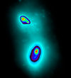 Two black holes have been pinpointed at the center of a collision of two galaxies thanks to adaptive optics at the Keck Observatory.