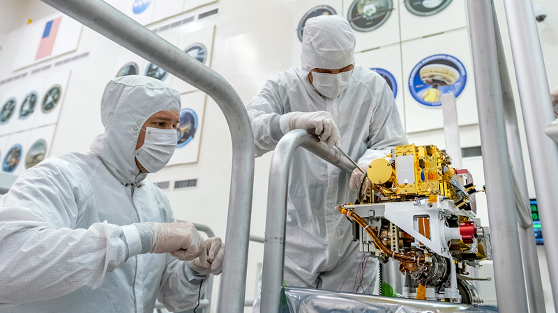 NASA engineers install the SuperCam instrument on Mars 2020's rover.