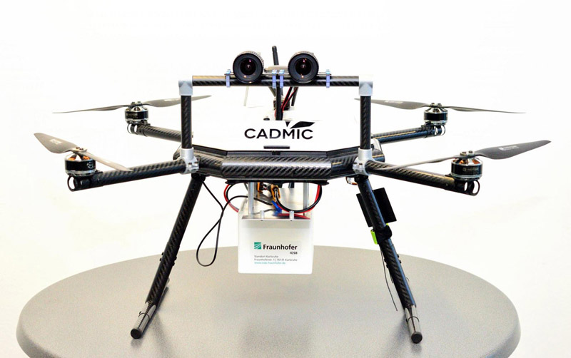 Drone with stereo camera; the white box holds the embedded system.