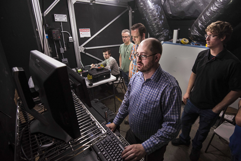 The Sandia research team reviews data coming in from a fog test.