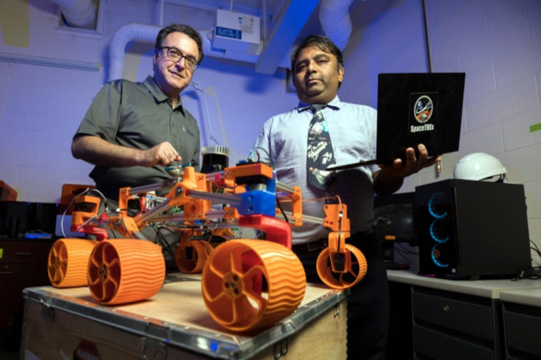 Arizona engineers Moe Momayez and Jekan Thanga with 3D-printed rover prototype.