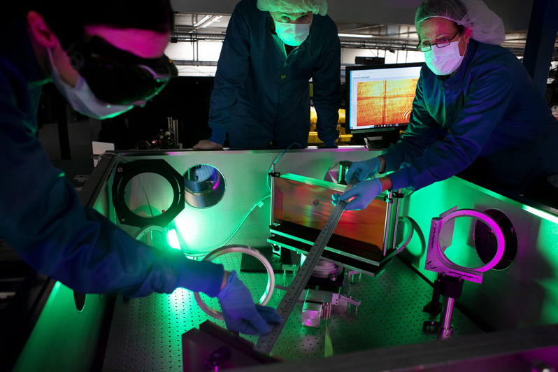 Researchers at the NSF ZEUS laser facility in a Michigan Engineering lab.