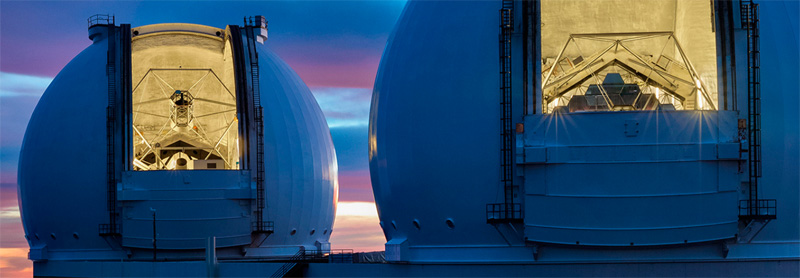 Twin telescopes Keck I and Keck 2 with their “eyes” open.