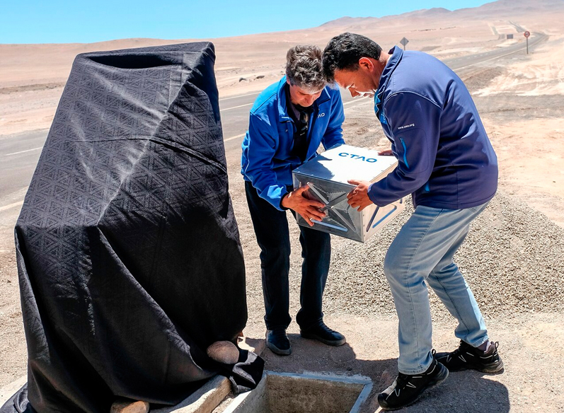 Installing the time-capsule at the inauguration of CTAO-South.