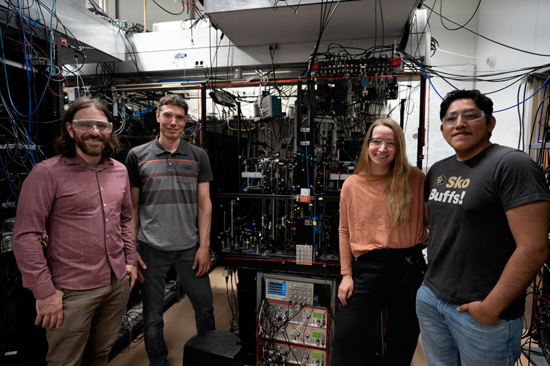 Marshall, Hume, Arthur-Dworschack, and Rodriguez Castillo with the ion clock. Marshall, Hume, Arthur-Dworschack, and Rodriguez Castillo with the ion clock.