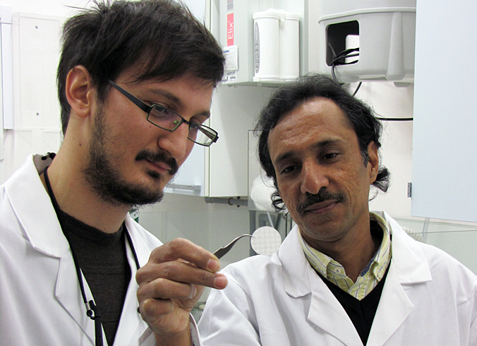 Fine print:Dr Collin Sones (left) and PhD student Ioannis Katis inspect paper sensor.