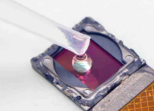 A test sample is placed directly onto the surface of the (cellphone's) image sensor.