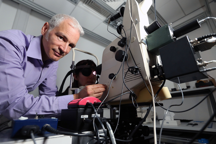 Dr Tom Margrain with his retinal densitometer at Cardiff University.