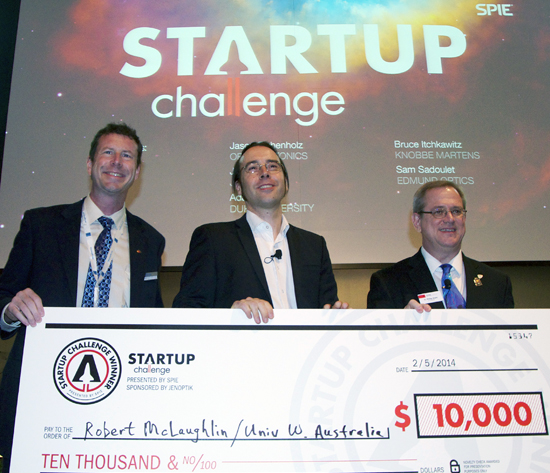 Robert McLaughlin (center) is presented with his Startup Challenge prize.