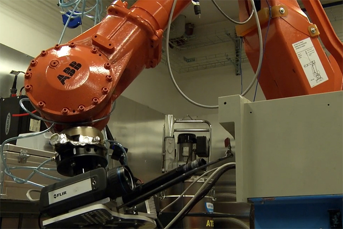 The weld scanning system is mounted on a robot arm.