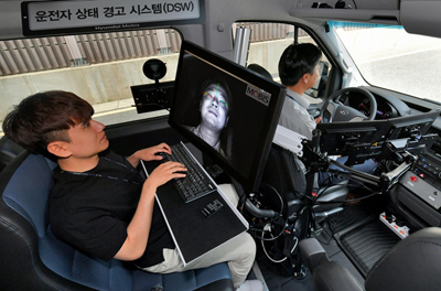 Both recognizes a driver's face and tracks eye movements.