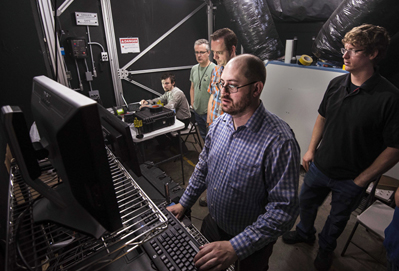 The Sandia research team reviews data coming in from a fog test.