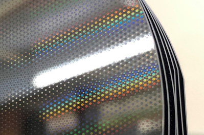 Silicon mirrors with etched stress correction patterns.
