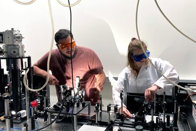 Sergio Chacon and Rachel Penner set up perovskite solar cell test.