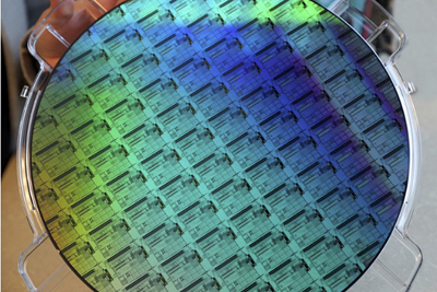 Image of a silicon photonics wafer manufactured by AIM Photonics.
