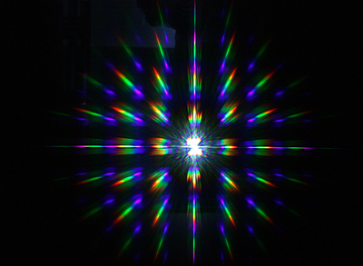 Diffractive image generated by the holographic structure produced on glass.