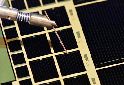 Three-junction epitaxial lift-off (ELO) thin-film solar cell.