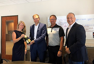Prost! Prodomax and Jenoptik Group CEOs toast the deal.